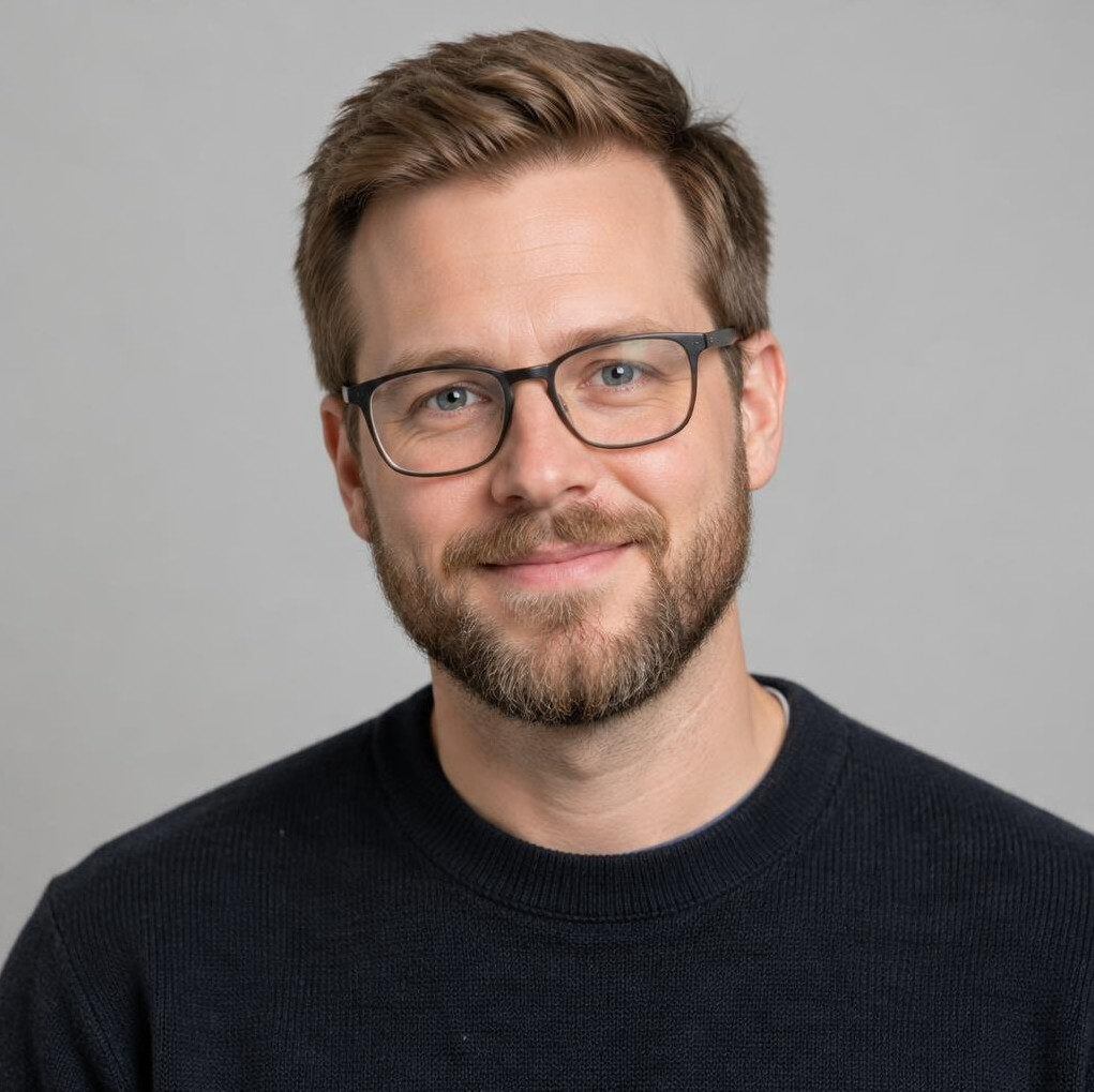 Portrait of a bearded man with glasses